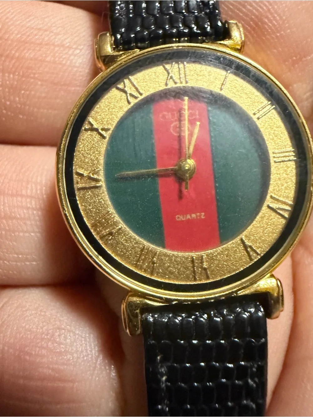 Gold-Tone Watch with Black Strap and Green-Red Dial